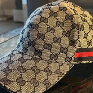 You feeling GUCCI? Gucci Beige and Black Monogram Cap with Red and Green Stripe